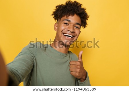 ストックフォト: Portrait Of Joyous African Man Having Stylish Afro Hairdo Smilin