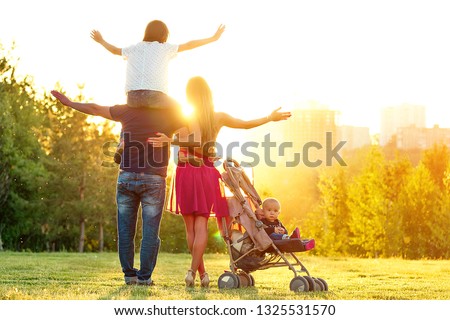 Stockfoto: Happy Active Family Photosession Beautiful Long Haired Mother Her Husband With Her Kid Rest In The