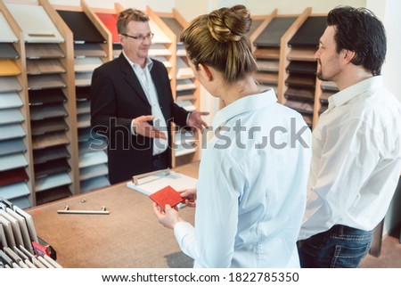 Сток-фото: Woman Man And Expert Discussing Details Of New Kitchen Finish