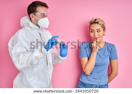 Foto stock: Young Doctor In Gloves And Uniform Going To Examine Sick Ear Of Patient