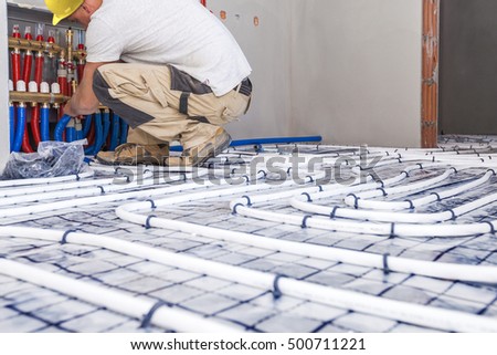 Stock photo: Pipe Fitter Mounted Underfloor Heating Heating System And Underfloor Heating