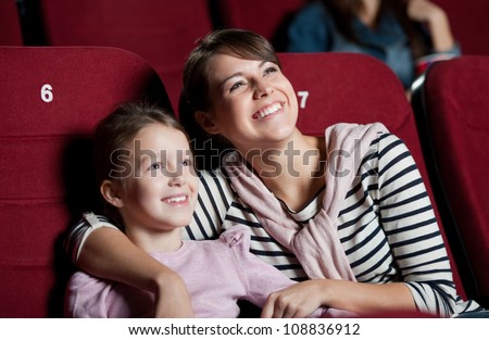 [[stock_photo]]: Horizontal Shot Of Beautiful Brunette Mother And Daughter Spend Free Time Together Sit On Window Si