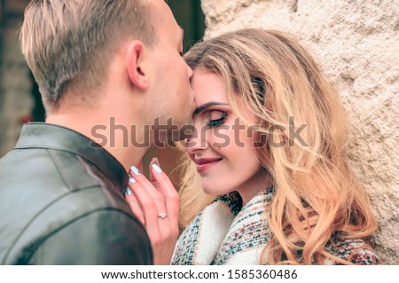 Stock photo: Happy Man Kissing His Beautiful Girl On The Forehead And Covers Her Blanket A Handsome Man Kiss On