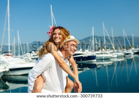 Foto stock: Attractive Young Couple Walking Alongside The Marina - Wedding C
