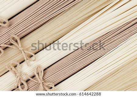 Foto d'archivio: Bundles Of Raw Asian Noodles Texture Top View As Abstract Food Background