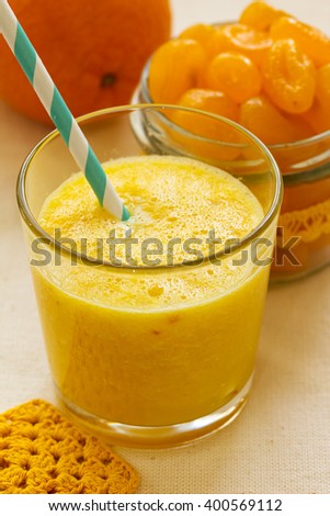 [[stock_photo]]: Freshly Blended Orange Citrus Kumquat Fruit Smoothie In Glass Jars With Straw Mint Leaf Cute Ripe