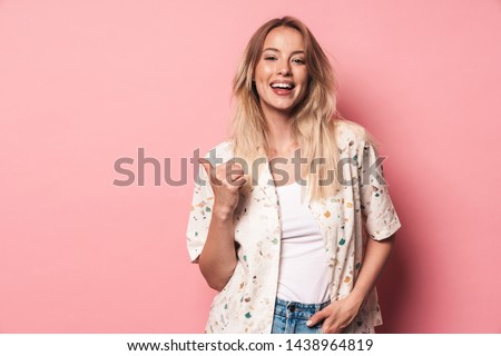 Zdjęcia stock: Cute Young Lady Posing Isolated Over Pink Background Wall Holding Flower