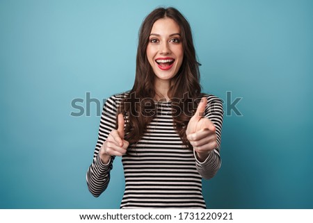 Foto stock: Emotional Young Woman Posing Isolated Over Blue Background Wall Holding Passport And Tickets