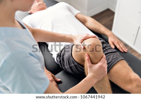 Сток-фото: Patient At The Physiotherapy Doing Physical Exercises With His Therapist