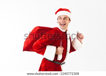 Zdjęcia stock: Portrait Of Joyful Man 30s In Santa Claus Costume And Red Hat Ho