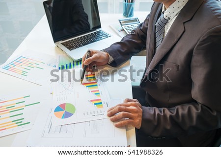 Stockfoto: Businessman Working Plan The Business And Analysis Many Chart Gr