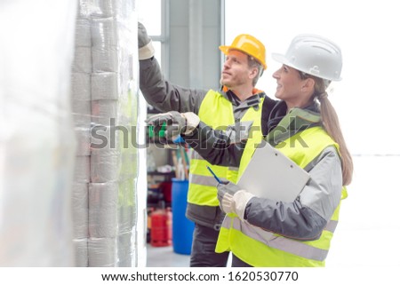 Zdjęcia stock: Workers In The Rental Toilet Business Checking The Paper Stock