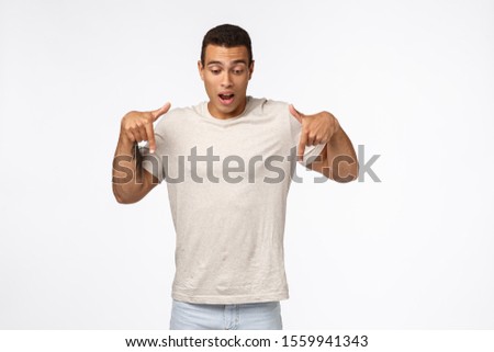 Stock foto: Fascinated And Astonished Handsome Speechless Hispanic Muscular Man In White T Shirt Holding Breat