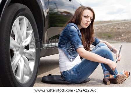 Stock fotó: Female Fixing Her Car