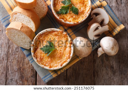 Stock photo: Casserole With Chicken And Mushrooms Julienne On The Table Top