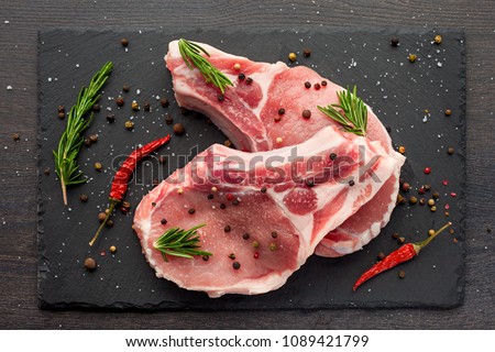 Stock fotó: Cooking On Kitchen Table Fresh Raw Pork Marbled Steaks On Black Background Top View