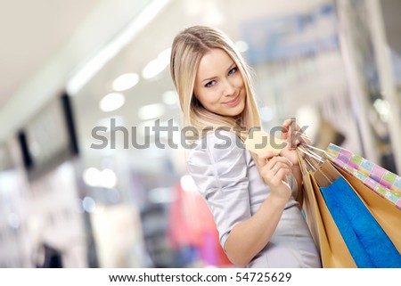 Stockfoto: Portrait Of Joyful Blond Woman 20s Holding Credit Card And Fan O