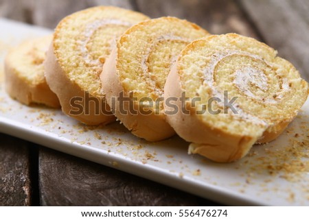 ストックフォト: Sponge Cake Roll Slices Isolated On White Background With Chocolate Vanilla And Berry Cream Diffe