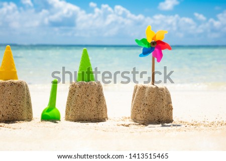 Stock fotó: Toys And Pinwheel In Front Of Sea At Beach