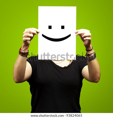 Foto stock: Person Holding A Paper With Funny Emoticon In Front Of Her Face