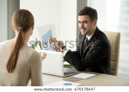 [[stock_photo]]: Businessman Discuss Explaining New Trends Information On A Docum