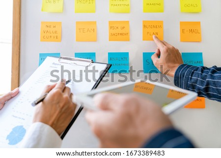 ストックフォト: Business People Arranging Sticky Notes Commenting And Brainstorm