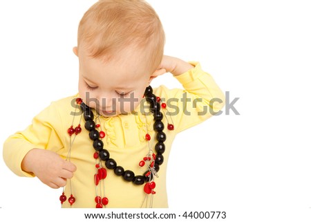 Сток-фото: Portrait Of Little Girl Eyes Set Down In Yellow Shirt With Beads On White Background