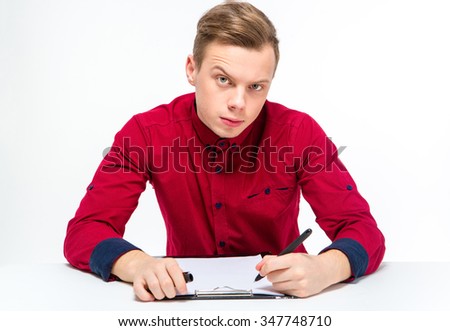 Сток-фото: Suspicious Curious Male With Raised Eyebrow Writing On Clipboard