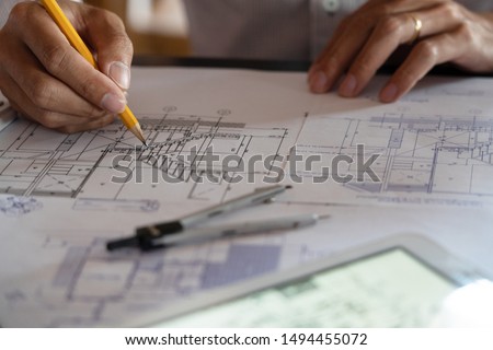 Foto stock: Real Estate Concept Two Engineer And Architect Discussing Bluep