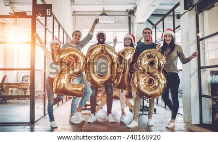 Stockfoto: Merry Christmas And Happy New Year Young Business Team Are Cele