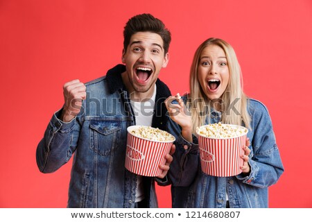 Stock foto: Portrait Of Smiling Couple Standing With Snacks
