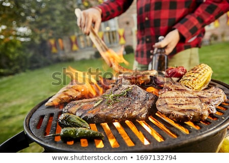 Foto stock: Grilled Beef With Beer And Corn