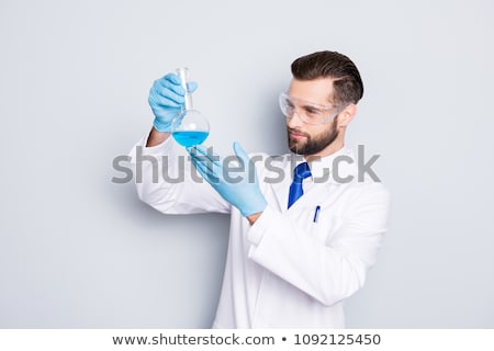 Foto stock: Scientist Experimenting With Colorfull Fluids