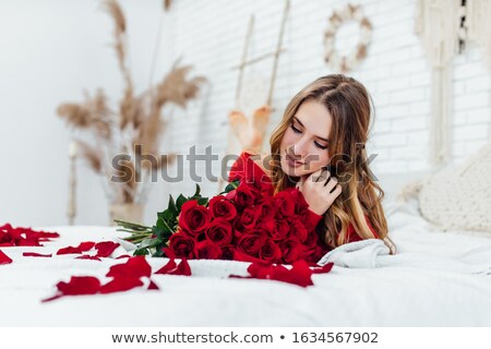 ストックフォト: Blonde Lying In Rose Petals