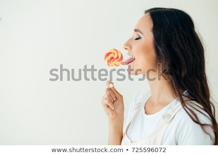 Stock photo: Coquette Funny Quaint Brunette With Colorful Lollipop