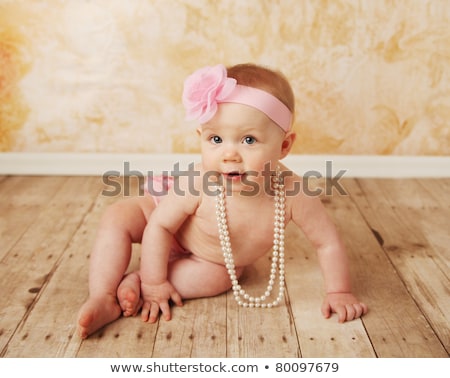 Imagine de stoc: Baby Girl With Pearl Necklace