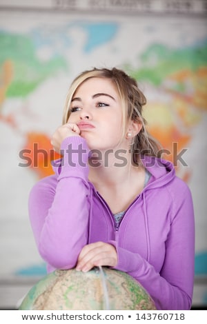 Foto stock: Young Girl In Geography Class