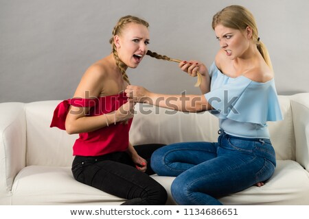 Stok fotoğraf: Two Women Having A Fight In Bathroom