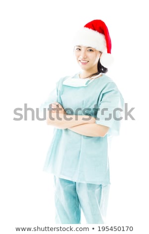 Stockfoto: Asian Female Surgeon Wearing Santa Hat