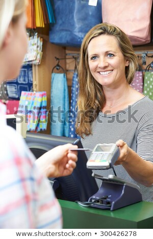 Stock fotó: Shopper Paying For Goods Using Credit Card Machine