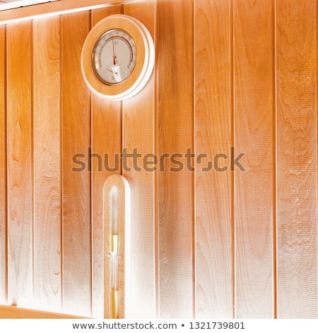 Stockfoto: Round Thermometer On The Wall Of Traditional Wooden Sauna