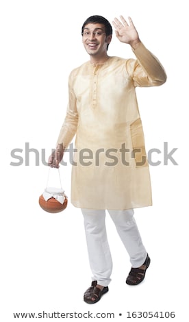 [[stock_photo]]: Bengali Man Carrying A Pot Of Rasgulla And Waving Hand