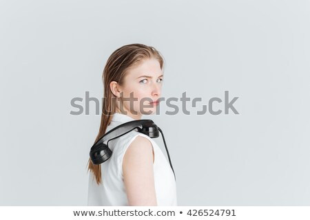 [[stock_photo]]: Woman Standing With Retro Phone Tube On The Shoulder
