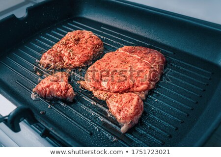 Stockfoto: Slices Of Raw Beef On Spatula
