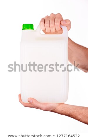 Stock photo: White Plastic Tank Canister In Female Hand