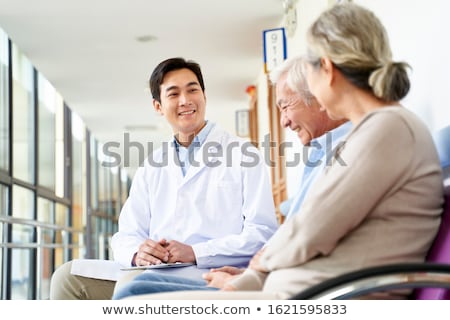 Stockfoto: Couple Chatting In Corridor