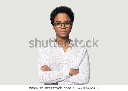 Stock photo: Portrait Of A Serious Woman Standing With Arms Folded