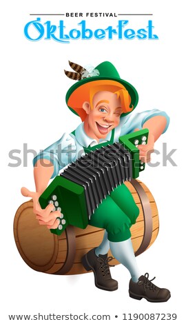 Foto d'archivio: Oktoberfest Beer Festival Young German Man Sit On Wooden Barrel And Play An Accordion