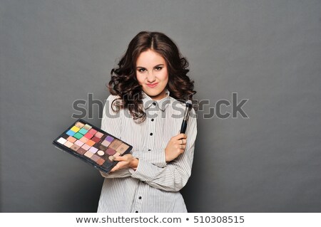 Stockfoto: Makeup Artist Paints A Very Pretty Brunette