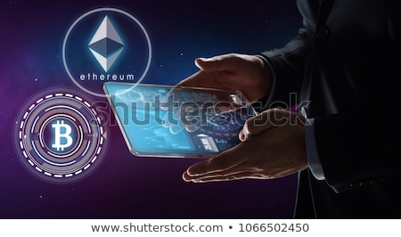 Foto stock: Close Up Of Businessman With Bitcoin Hologram